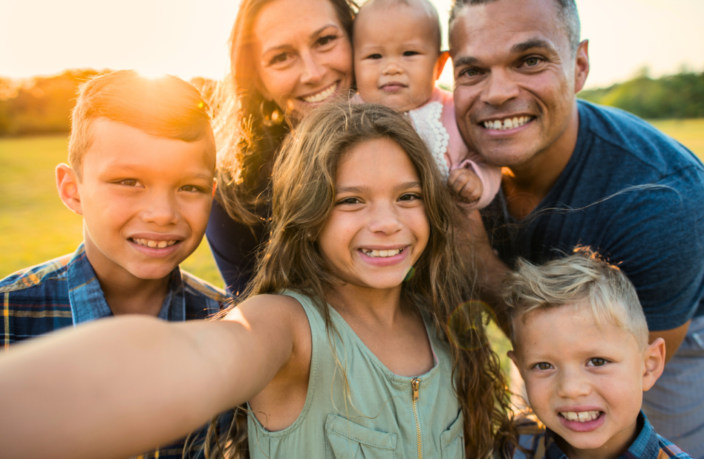 Family outdoors taking a group selfie. Food Intolerance or Food Allergies. Naturopath Sunshine Coast. Brisbane Livewell Clinic