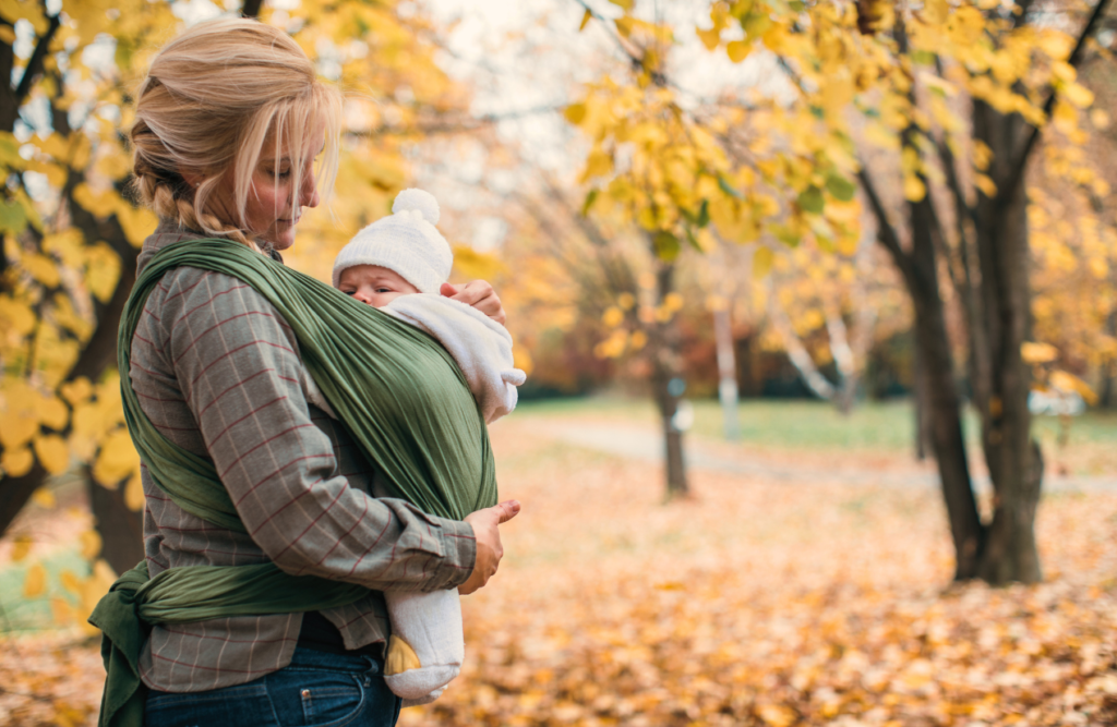 Mom carrying her baby. Acupuncture. Brisbane Livewell Clinic