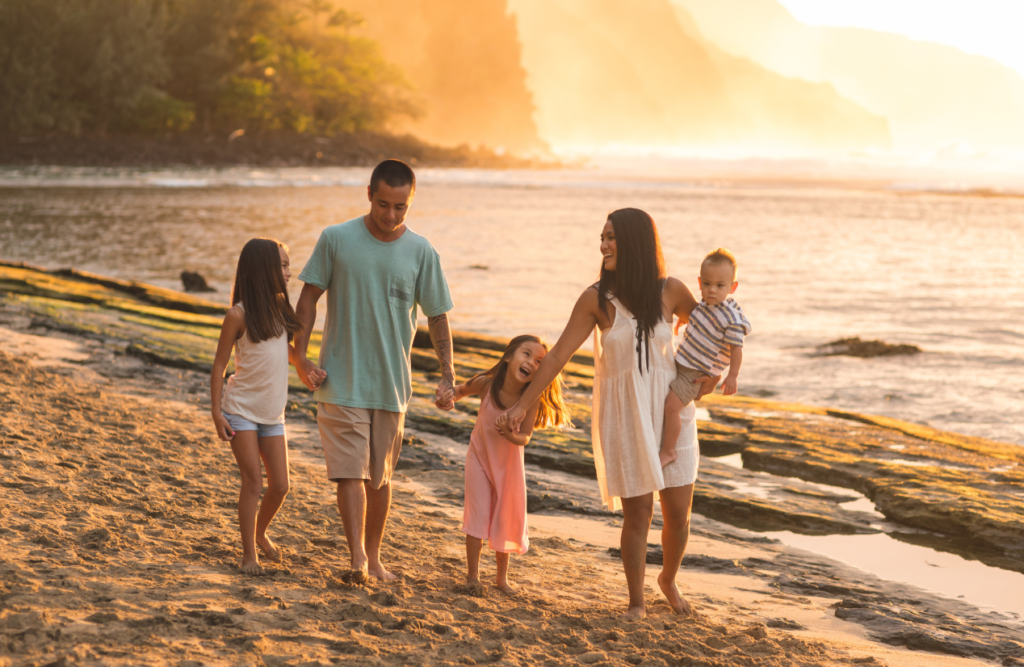 Family walking together at the beach. Brisbane Livewell Clinic. What does a Naturopath do? Naturopath Brisbane Northside