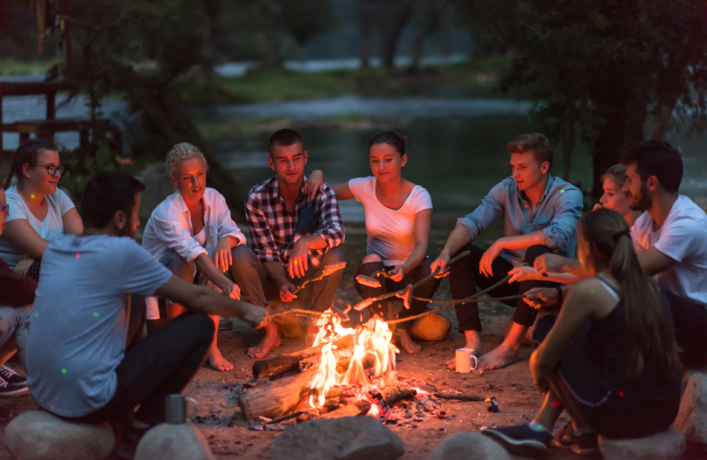 Friends sitting around a campfire. Hypnotherapy services. Brisbane Livewell Clinic