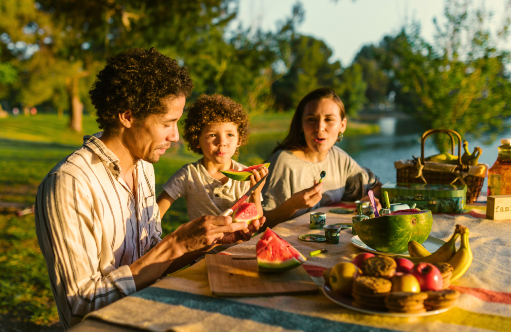 Family on a picnic eating watermelon. Is hypnotherapy covered by Medicare. Brisbane Livewell Clinic. Counselling Near Me. Counselling Wavell Heights