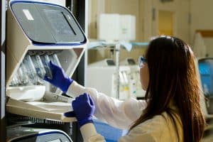 Scientist holding test tubes. DNA Genetic Methylation Test Cost Australia