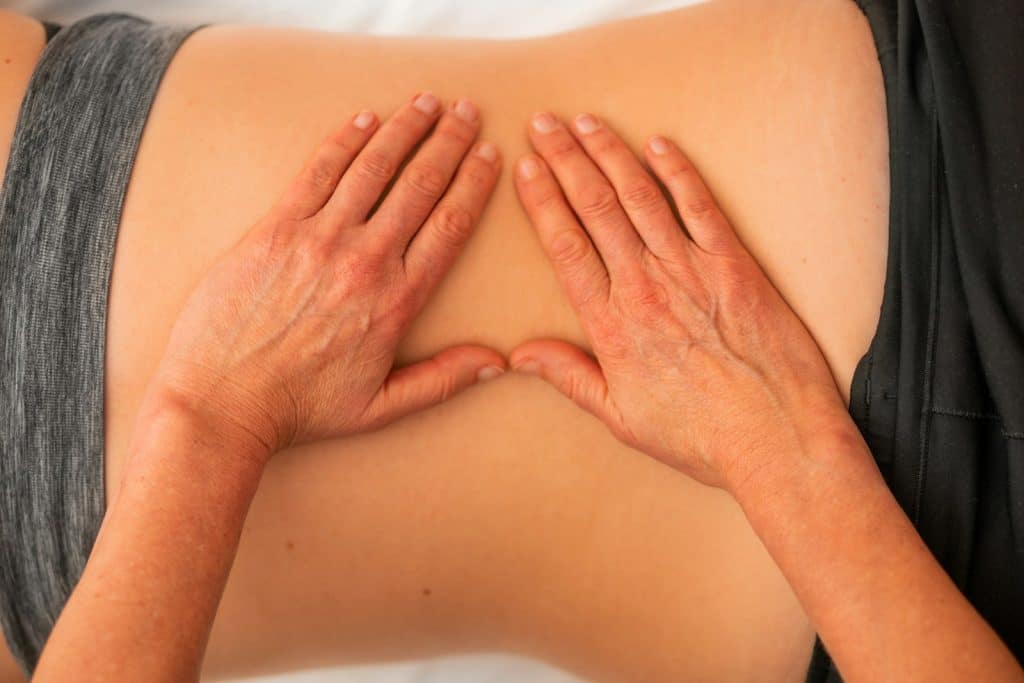 Woman receiving Lymphatic Drainage Massage at Brisbane Livewell Clinic. Myofascial Release Therapy Near Me. Therapeutic Massage Treatment. Massage Quiz