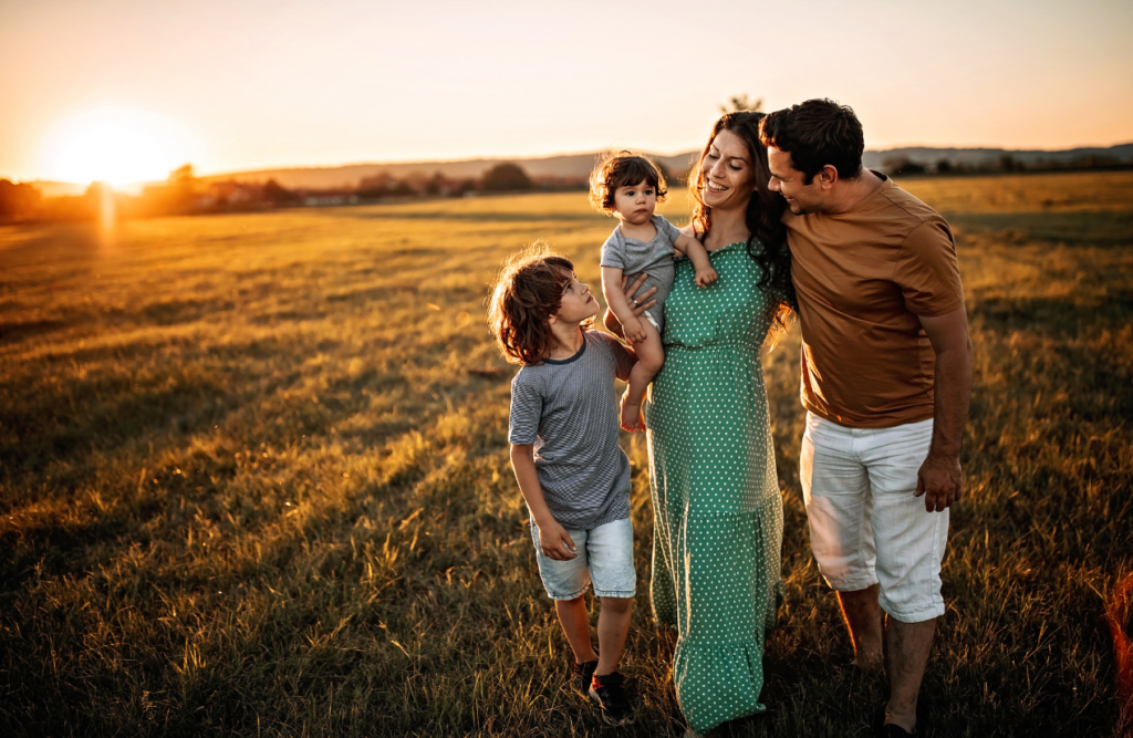 Family walking in a field. What is Lymphatic Drainage Massage. Hypnotherapy Brisbane. Brisbane Livewell Clinic