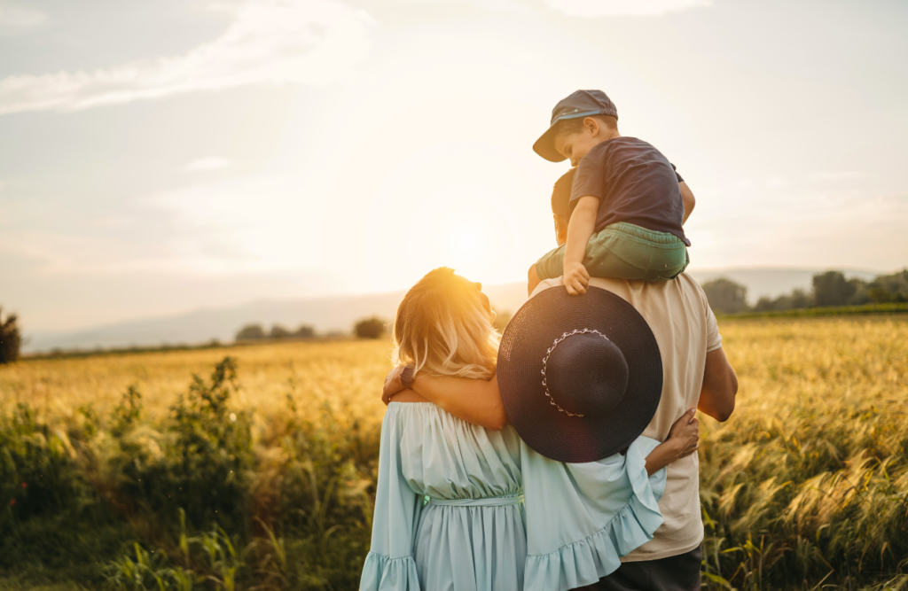 Family enjoying sunset in nature. What is Lymphatic Drainage Massage. Brisbane Livewell Clinic