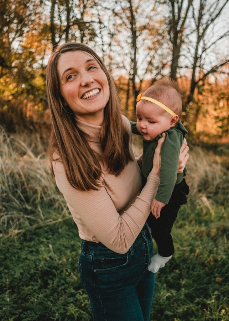 Woman holding a baby in her arms. Bowen Therapy in Brisbane