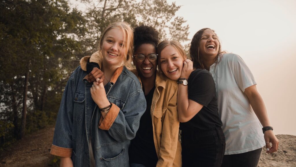 4 friends laughing. Bowen Therapy Brisbane