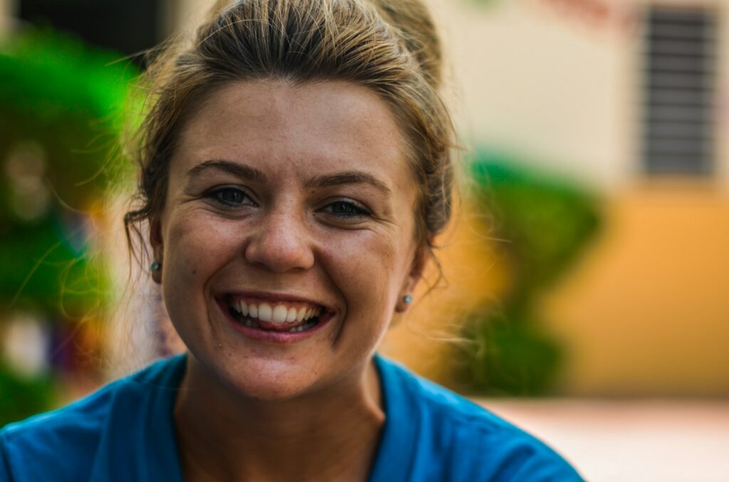 Woman smiling after seeing a Naturopath near me