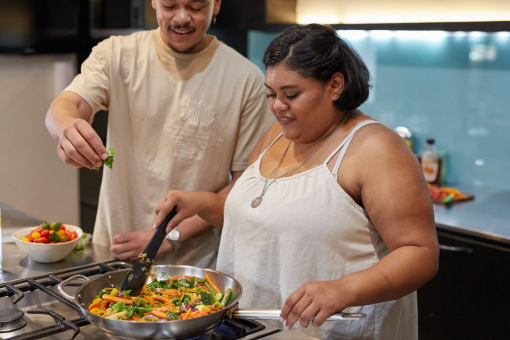 Couple preparing healthy food in a kitchen. Dietician for Weight Loss.