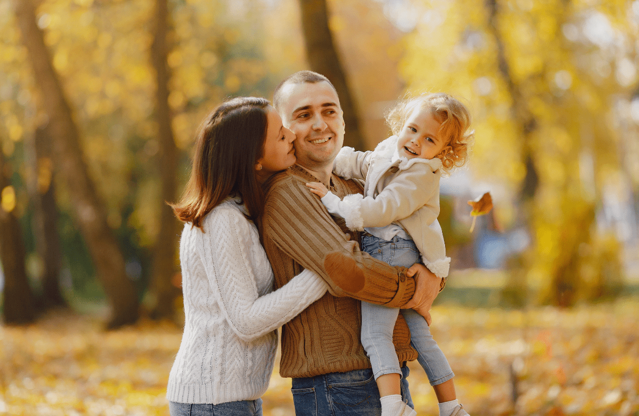 A cheerful family of three at the park. Iridology. Brisbane Livewell Clinic. Northgate Brisbane. Can a Naturopath help with my health issues