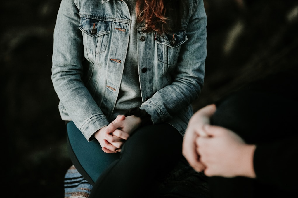 Woman wearing gray jacket speaking with a Counsellor. What is Counselling?