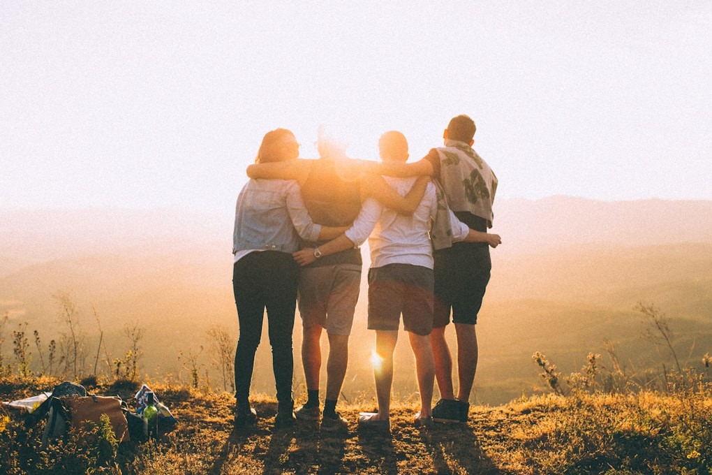 Four teenagers hugging. Youth Counselling in Brisbane