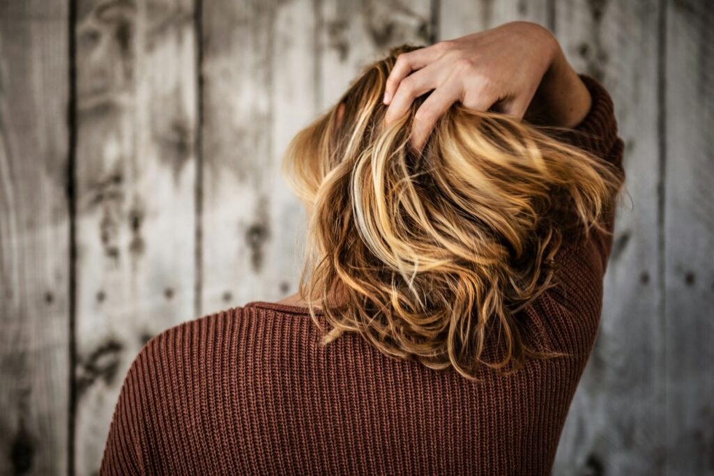 Woman holding her hair back. Heavy Metal Detox.