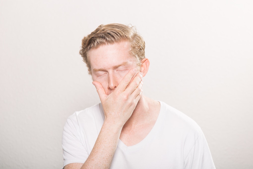 Man covering his mouth. Naturopath for Mens Health