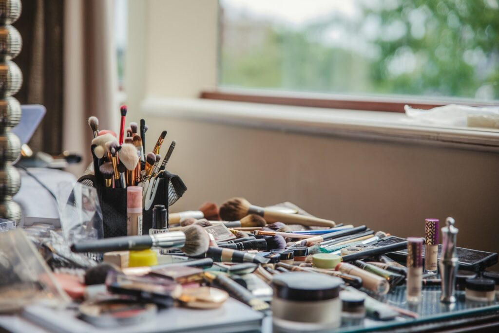 Desk full of various cosmetics. Heavy Metals Detox.