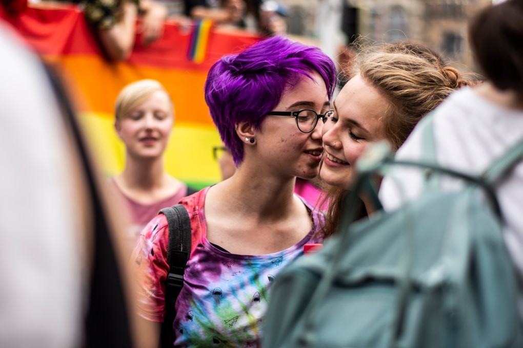 Teenage girl with purple hair kissing girlfriend. Youth Counselling in Brisbane