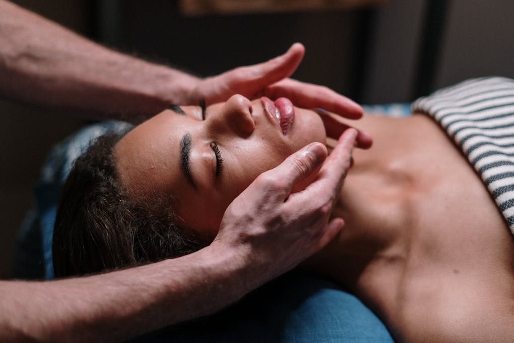 Woman receiving massage on her face. What is myofascial release therapy?