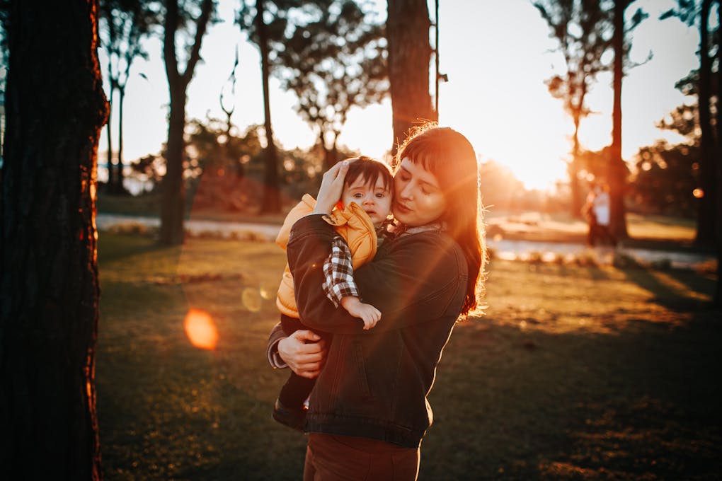 Woman and boy hugging in park. Clinical Hypnotherapy Cannon Hill