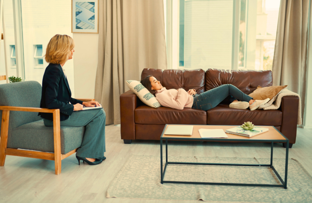 Woman lying down on the couch for her Hypbotherapy session. Power of Hypnosis. Brisbane Livewell Clinic