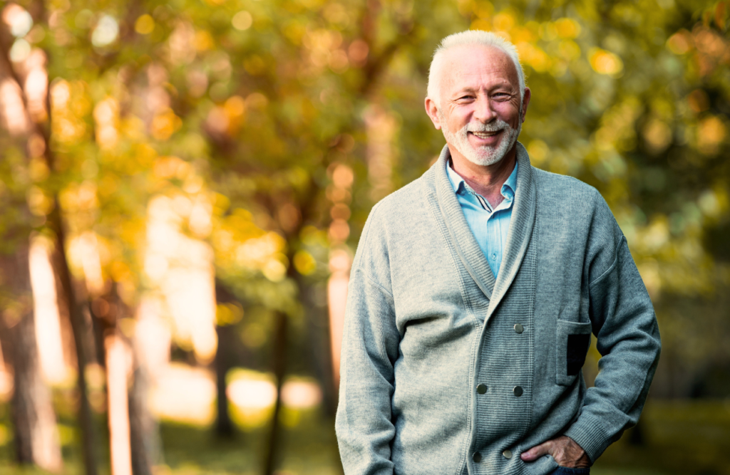 Man around 60 smiling after a successful hypnotherapy for alcoholism. Hypnotherapy for Alcoholism. Brisbane Livewell Clinic. Hypnosis for smoking cessation and quitting vaping