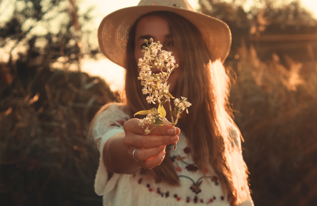 Woman holding white petaled flowers. Hypnosis sleep. Brisbane Livewell Clinic