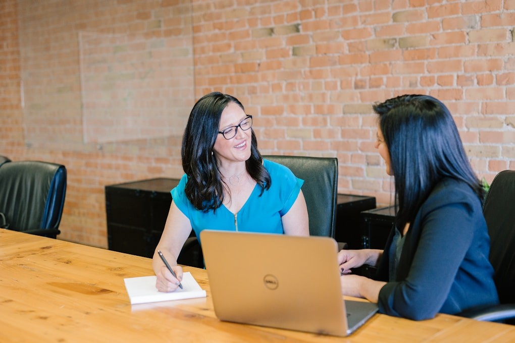 Female patient consulting her Naturopath after considering Homeopathic vs Naturopathic Medicine