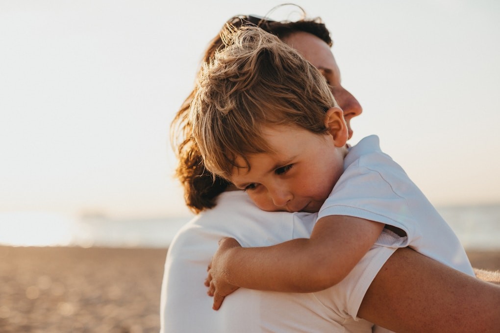 Mother hugging child. Hypnosis for Smoking Cessation and Vaping Cessation