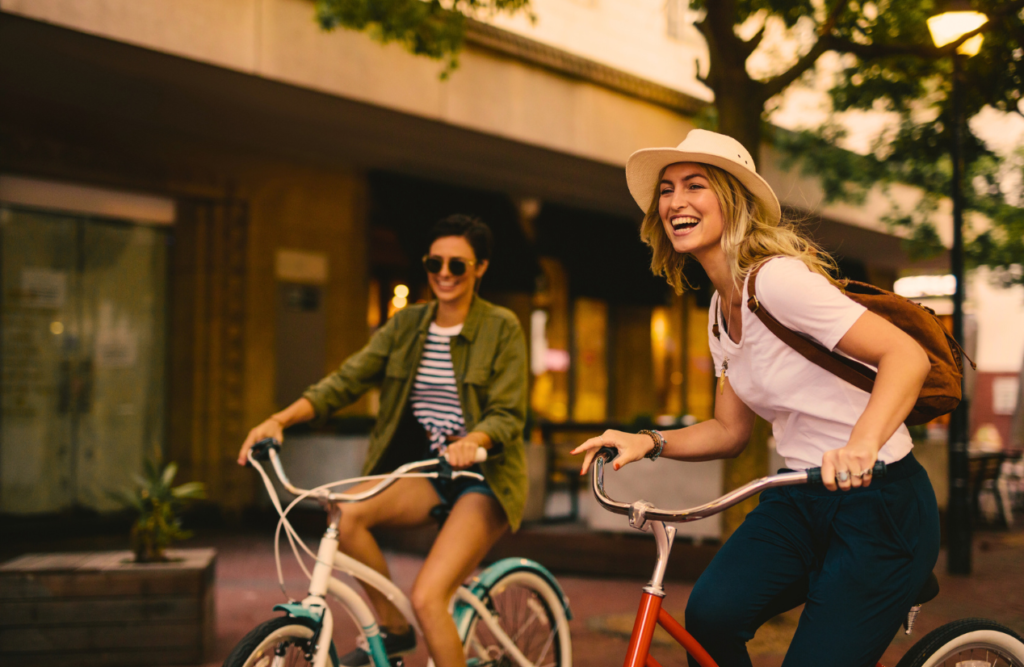 Two women enjoying bicycle ride. Naturopath North Brisbane. Brisbane Livewell Clinic. Hypnotherapy for Smoking