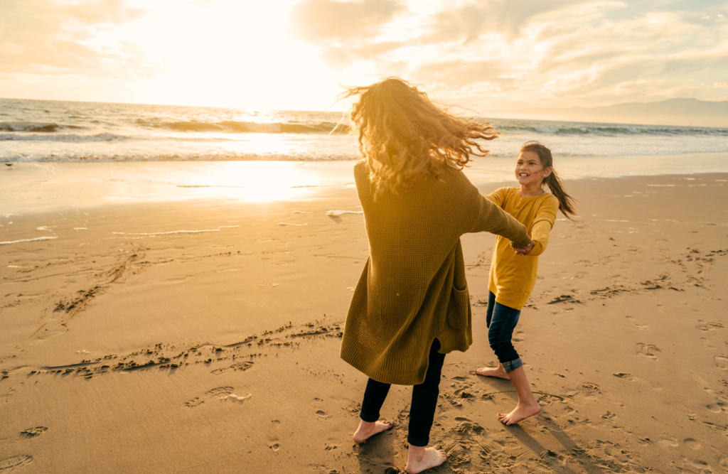 Mother and daughter enjoying sunny day at the beach. Naturopath North Brisbane. Brisbane Livewell Clinic. Hypnotherapy to Quit Smoking