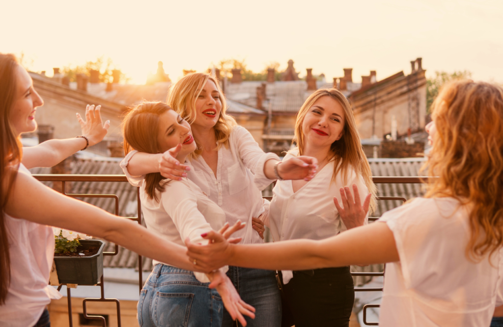 Women having fun together at the balcony. Naturopath North Brisbane. Brisbane Livewell Clinic