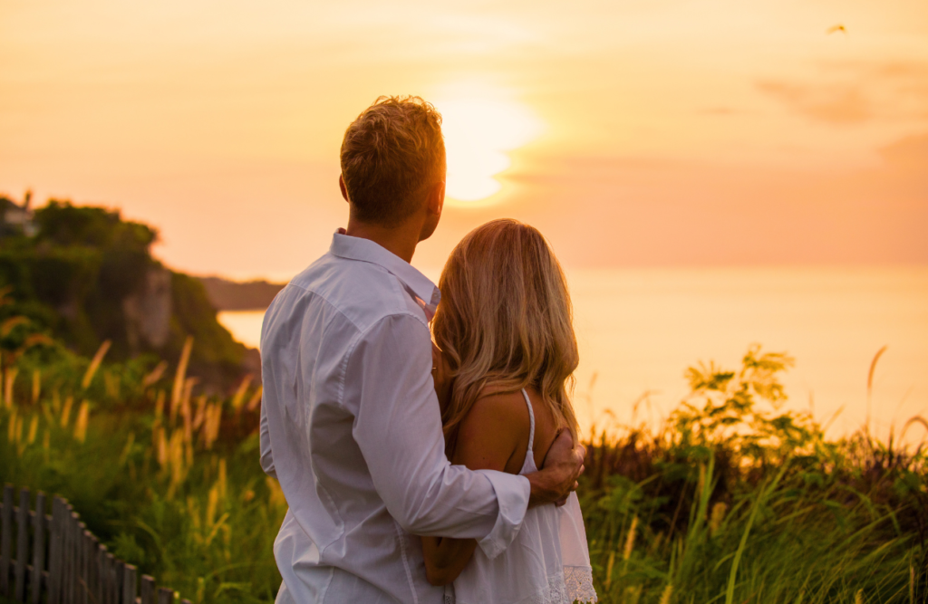 Couple watching at the ocean as the sun sets. Naturopath Cannon Hill. Brisbane Livewell Clinic