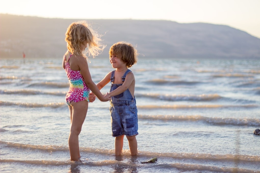 Two girls standing on seashore. Sunshine Coast Naturopath. Noosa